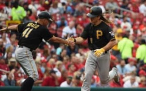 Oct 2, 2016; St. Louis, MO, USA; Pittsburgh Pirates first baseman John Jaso (28) is congratulated by third base coach Rick Sofield (41) after hitting a two run home run off of St. Louis Cardinals relief pitcher Jonathan Broxton (not pictured) during the seventh inning at Busch Stadium. Mandatory Credit: Jeff Curry-USA TODAY Sports