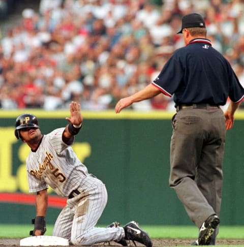 Pittsburgh Pirates base runner Tony Womack calls for time to umpire Jim Joyce after stealing second base during the fifth inning of their 10 June game with the Pittsburgh Pirates at Jacobs Field in Cleveland, OH. The Pirates later won the game in the eleventh inning 4-3. AFP PHOTO/Anthony ONCHAK (Photo by ANTHONY ONCHAK / AFP) (Photo credit should read ANTHONY ONCHAK/AFP via Getty Images)