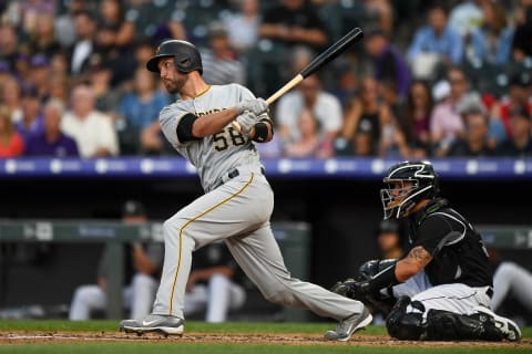 DENVER, CO – AUGUST 31: Jacob Stallings #58 of the Pittsburgh Pirates hits a single against the Colorado Rockies in the third inning of a game at Coors Field on August 31, 2019 in Denver, Colorado. (Photo by Dustin Bradford/Getty Images)