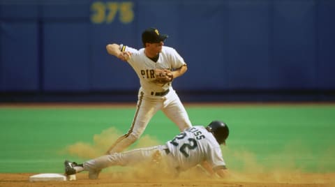 PITTSBURGH, PA – 1993: Shortstop Jay Bell of the Pittsburgh Pirates throws to first base in an attempt to complete a double play as Walt Weiss #22 of the Florida Marlins slides into second base during a Major League Baseball game at Three Rivers Stadium in 1993 in Pittsburgh, Pennsylvania. (Photo by George Gojkovich/Getty Images)