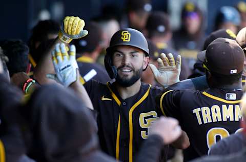 PEORIA, ARIZONA – MARCH 05: Eric Hosmer #30 of the San Diego Padres is congratulated by teammates after scoring a run against the Seattle Mariners during the fourth inning of a Cactus League spring training baseball game at Peoria Stadium on March 05, 2020 in Peoria, Arizona. (Photo by Ralph Freso/Getty Images)