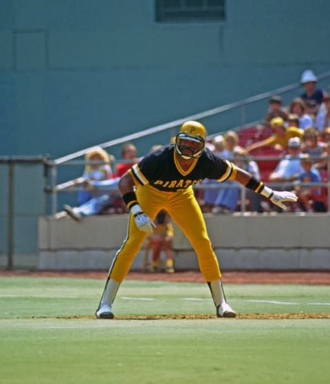 PITTSBURGH, PA – 1978: Dave Parker of the Pittsburgh Pirates leads off first base during a Major League Baseball game at Three Rivers Stadium in 1978 in Pittsburgh, Pennsylvania. Parker is wearing a football helmet type faceguard attached to his batting helmet to protect a fractured jaw and cheekbone. (Photo by George Gojkovich/Getty Images)