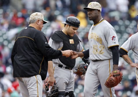 DETROIT, MI – MAY 27: Pitcher Jose Contreras of the Pittsburgh Pirates is pulled from the game by manager Clint Hurdle #13 as catcher Russell Martin waits on the mound in the seventh inning of an interleague game against the Detroit Tigers at Comerica Park on May 27, 2013 in Detroit, Michigan. Contreras gave up two runs and four hits while walking four batters in the seventh inning. (Photo by Duane Burleson/Getty Images)