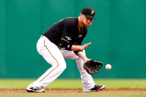 PITTSBURGH, PA – OCTOBER 07: Clint Barmes #12 of the Pittsburgh Pirates field the ball in the second inning against the St. Louis Cardinals during Game Four of the National League Division Series at PNC Park on October 7, 2013 in Pittsburgh, Pennsylvania. (Photo by Jared Wickerham/Getty Images)