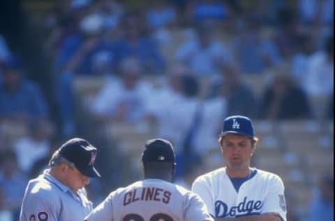 15 Jul 1998: Glenn Hoffman #22 of the Los Angeles Dodgers confers with coach Gene Clines #20 of the San Francisco Giants during a game at the Dodger Stadium in Los Angeles, California. The Giants defeated the Dodgers 5-3. Mandatory Credit: Elsa Hasch /A