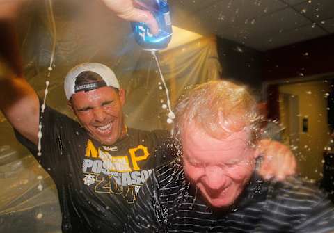 ATLANTA, GA – SEPTEMBER 23: Pittsburgh Pirates GM Neal Huntington is doused with beer by Tony Sanchez #26 as they celebrate clinching a National League playoff spot after their 3-2 win over the Atlanta Braves at Turner Field on September 23, 2014 in Atlanta, Georgia. (Photo by Kevin C. Cox/Getty Images)