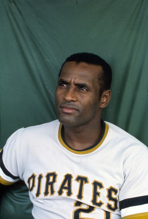 PITTSBURGH, PA – CIRCA 1970: Outfielder Roberto Clemente’ #21of Pittsburgh Pirates looks on from the dugout during an Major League Baseball game circa 1970 at Three Rivers Stadium in Pittsburgh, Pennsylvania. Clemente’ Played for the Pirates from 1955-72. (Photo by Focus on Sport/Getty Images)