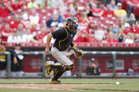 CINCINNATI, OH – APRIL 9: Tony Sanchez #26 of the Pittsburgh Pirates works behind the plate wearing Under Armour gear during the game against the Cincinnati Reds at Great American Ball Park on April 9, 2015 in Cincinnati, Ohio. The Reds defeated the Pirates 3-2. (Photo by Joe Robbins/Getty Images)