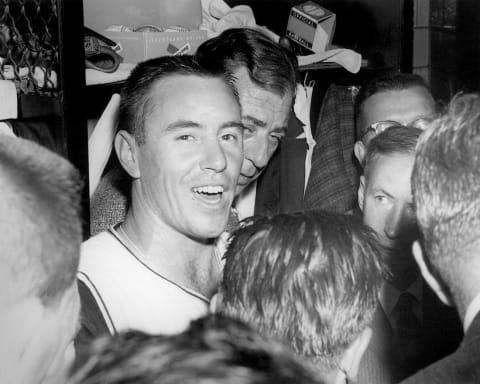 PITTSBURGH – 1960: Bill Mazeroski #9 of the Pittsburgh Pirates talks to the media in the locker room after a 1960 World Series game against the New York Yankees at Forbes Field in Pittsburgh, Pennsylvania. (Photo by Morris Berman/MLB Photos via Getty Images)