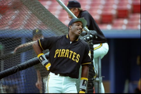 PITTSBURGH – 1991: Outfielder Barry Bonds of the Pittsburgh Pirates smiles while talking with other players near the batting cage before a game at Three Rivers Stadium in 1991 in Pittsburgh, Pennsylvania. (Photo by George Gojkovich/Getty Images)Pirates