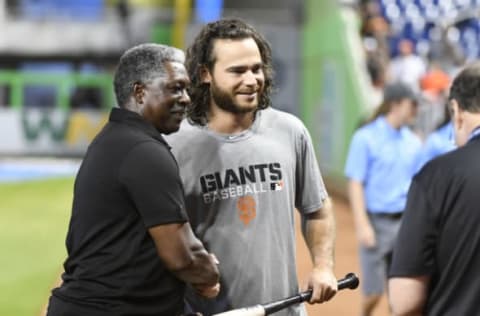 MIAMI, FL – AUGUST 10: Brandon Crawford #35 of the San Francisco Giants shakes hands with former Major Leaguer Rennie Stennett before the start of the game against the Miami Marlins at Marlins Park on August 10, 2016 in Miami, Florida. (Photo by Eric Espada/Getty Images)