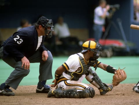 PITTSBURGH, PA – 1985: Major League Baseball umpire Lee Weyer #23 looks over the shoulder of catcher Tony Pena of the Pittsburgh Pirates during a game at Three Rivers Stadium in 1985 in Pittsburgh, Pennsylvania. (Photo by George Gojkovich/Getty Images)