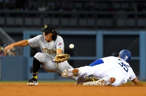 LOS ANGELES, CA – APRIL 27: Cody Bellinger #35 of the Los Angeles Dodgers is safe at second with a stolen base as the ball get past Cole Tucker #3 of the Pittsburgh Pirates in the eighth inning of the game at Dodger Stadium on April 27, 2019 in Los Angeles, California. (Photo by Jayne Kamin-Oncea/Getty Images)