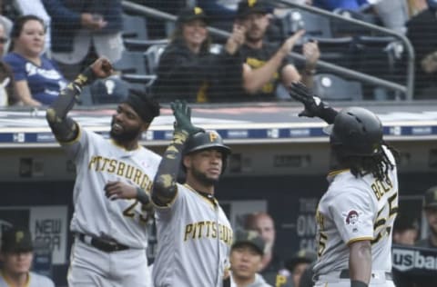 SAN DIEGO, CA – MAY 18: Josh Bell #55 of the Pittsburgh Pirates (R) is congratulated by Elias Diaz #32 after hitting a solo home run during the second inning of a baseball game against the San Diego Padres at Petco Park May 18, 2019 in San Diego, California. (Photo by Denis Poroy/Getty Images)