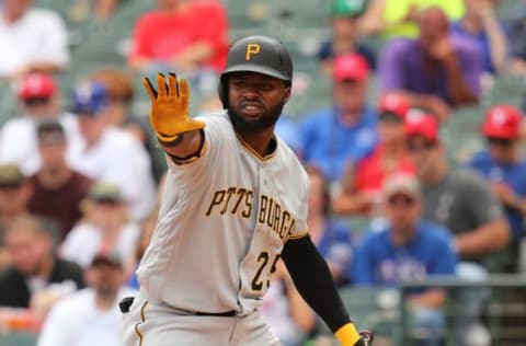 ARLINGTON, TEXAS – MAY 01: Gregory Polanco #25 of the Pittsburgh Pirates motions for the runner to stay at third in the seventh inning against the Texas Rangers at Globe Life Park in Arlington on May 01, 2019 in Arlington, Texas. (Photo by Richard Rodriguez/Getty Images)