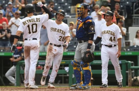 PITTSBURGH, PA – JULY 07: Bryan Reynolds #10 of the Pittsburgh Pirates celebrates with Adam Frazier #26 as he crosses home plate after hitting a three run home run in the seventh inning during the game against the Milwaukee Brewers at PNC Park on July 7, 2019 in Pittsburgh, Pennsylvania. (Photo by Justin Berl/Getty Images)