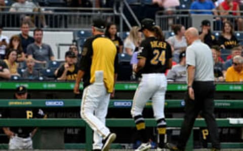 PITTSBURGH, PA – AUGUST 20: Chris Archer #24 of the Pittsburgh Pirates walks off the field with manager Clint Hurdle #13 and trainer Bryan Housand after suffering an apparent injury in the second inning during the game against the Washington Nationals at PNC Park on August 20, 2019 in Pittsburgh, Pennsylvania. (Photo by Justin Berl/Getty Images)