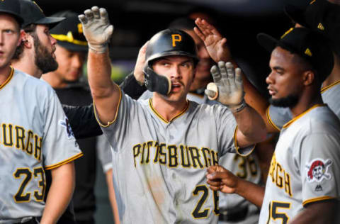 DENVER, CO – AUGUST 31: Adam Frazier #26 of the Pittsburgh Pirates is congratulated in the dugout after scoring a second inning run against the Colorado Rockies at Coors Field on August 31, 2019 in Denver, Colorado. (Photo by Dustin Bradford/Getty Images)