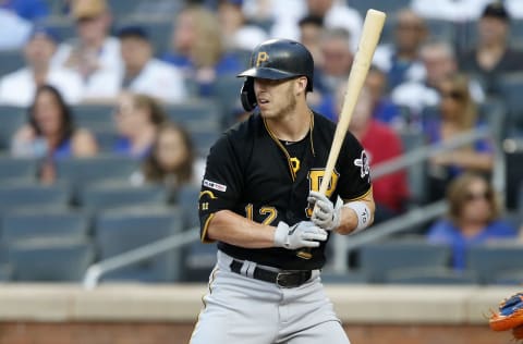 NEW YORK, NEW YORK – JULY 26: Corey Dickerson #12 of the Pittsburgh Pirates in action against the New York Mets at Citi Field on July 26, 2019 in New York City. The Mets defeated the Pirates 6-3. (Photo by Jim McIsaac/Getty Images)