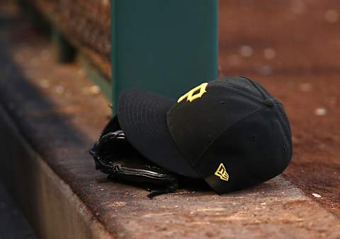 ANAHEIM, CALIFORNIA – AUGUST 14: A detalied view of a Pittsburgh Pirates hat and catching glove is seen on the dugout steps during the MLB game between the Pittsburgh Pirates and the Los Angeles Angels at Angel Stadium of Anaheim on August 14, 2019 in Anaheim, California. The Angels defeated the Pirates 7-4. (Photo by Victor Decolongon/Getty Images)