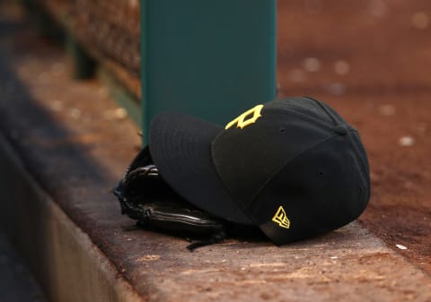 ANAHEIM, CALIFORNIA – AUGUST 14: A detalied view of a Pittsburgh Pirates hat and catching glove is seen on the dugout steps during the MLB game between the Pittsburgh Pirates and the Los Angeles Angels at Angel Stadium of Anaheim on August 14, 2019 in Anaheim, California. The Angels defeated the Pirates 7-4. (Photo by Victor Decolongon/Getty Images)