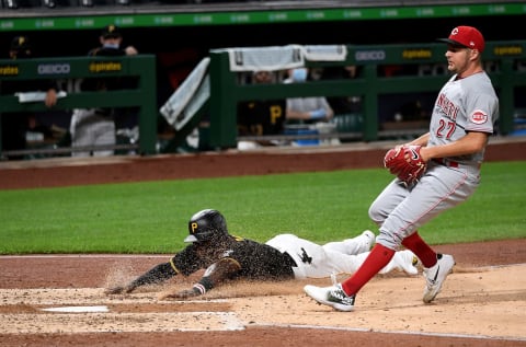 PITTSBURGH, PA – SEPTEMBER 04: Anthony Alford #6 of the Pittsburgh Pirates slides safely into home plate to score on run on a wild pitch by Trevor Bauer #27 of the Cincinnati Reds in the fourth inning during game two of a doubleheader at PNC Park on September 4, 2020 in Pittsburgh, Pennsylvania. (Photo by Justin Berl/Getty Images)