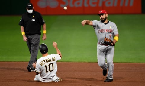 PITTSBURGH, PA – SEPTEMBER 05: Eugenio Suarez #7 of the Cincinnati Reds turns a double play against Bryan Reynolds #10 of the Pittsburgh Pirates in the fifth inning during the game at PNC Park on September 5, 2020 in Pittsburgh, Pennsylvania. (Photo by Justin Berl/Getty Images)