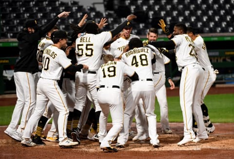 PITTSBURGH, PA – SEPTEMBER 22: Jacob Stallings #58 of the Pittsburgh Pirates is mobbed by teammates at home plate after hitting a walk off home run to give the Pirates a 3-2 win over the Chicago Cubs at PNC Park on September 22, 2020 in Pittsburgh, Pennsylvania. (Photo by Justin Berl/Getty Images)