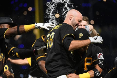 PITTSBURGH, PA – JULY 31: Jacob Stallings #58 of the Pittsburgh Pirates is hugged by Phillip Evans #24 after hitting a walk-off RBI fielders choice to give the Pirates a 3-2 win over the Philadelphia Phillies during the game at PNC Park on July 31, 2021 in Pittsburgh, Pennsylvania. (Photo by Justin Berl/Getty Images)