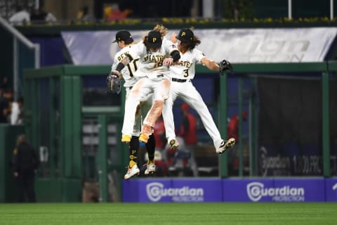 PITTSBURGH, PA – OCTOBER 02: Cole Tucker #3 of the Pittsburgh Pirates celebrates with Bryan Reynolds #10 and Ben Gamel #18 after the final out of an 8-6 win over the Cincinnati Reds during the game at PNC Park on October 2, 2021 in Pittsburgh, Pennsylvania. (Photo by Justin Berl/Getty Images)