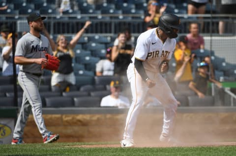 PITTSBURGH, PA – JULY 24: Greg Allen #24 of the Pittsburgh Pirates reacts after coming around to score on a two run RBI single by Yoshi Tsutsugo #25 (not pictured) in the ninth inning during the game against the Miami Marlins at PNC Park on July 24, 2022 in Pittsburgh, Pennsylvania. (Photo by Justin Berl/Getty Images)