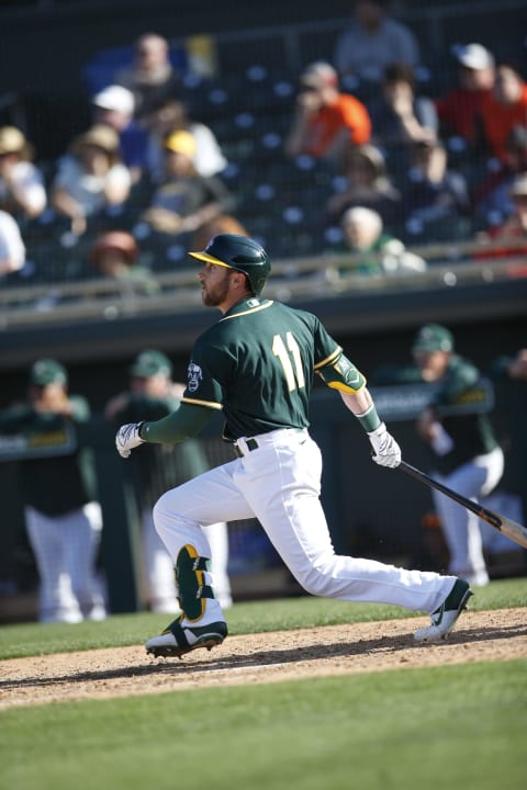 MESA, AZ – February 24: Dustin Fowler #11 of the Oakland Athletics bats during the game against the Milwaukee Brewers at Hohokam Stadium on February 24, 2020 in Mesa, Arizona. (Photo by Michael Zagaris/Oakland Athletics/Getty Images)