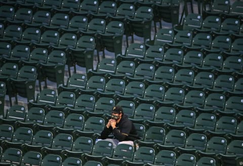 CHICAGO, ILLINOIS – AUGUST 01: A member of the Pittsburgh Pirates watches from the stands as his teammates take on the Chicago Cubs at Wrigley Field on August 01, 2020 in Chicago, Illinois. (Photo by Jonathan Daniel/Getty Images)