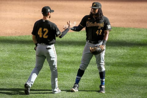 MILWAUKEE, WISCONSIN – AUGUST 30: JT Riddle #42 (L) and Josh Bell #42 of the Pittsburgh Pirates celebrate after beating the Milwaukee Brewers 5-1 at Miller Park on August 30, 2020 in Milwaukee, Wisconsin. All players are wearing #42 in honor of Jackie Robinson Day, which was postponed April 15 due to the coronavirus outbreak. (Photo by Dylan Buell/Getty Images)