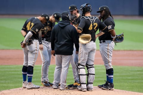 MILWAUKEE, WISCONSIN – AUGUST 29: Pitching coach Oscar Marin of the Pittsburgh Pirates meets with J.T. Brubaker #42 in the second inning against the Milwaukee Brewers at Miller Park on August 29, 2020 in Milwaukee, Wisconsin. All players are wearing #42 in honor of Jackie Robinson Day, which was postponed April 15 due to the coronavirus outbreak. (Photo by Dylan Buell/Getty Images)