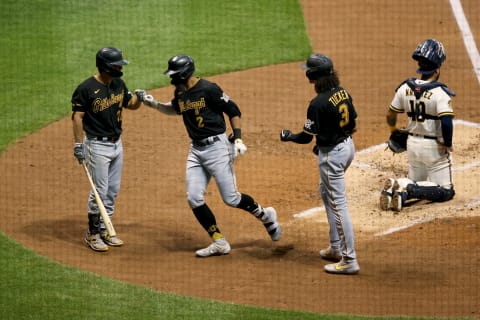 MILWAUKEE, WISCONSIN – AUGUST 31: Erik Gonzalez #2 of the Pittsburgh Pirates celebrates with Adam Frazier #26 and Cole Tucker #3 after hitting a home run in the third inning against the Milwaukee Brewers at Miller Park on August 31, 2020 in Milwaukee, Wisconsin. (Photo by Dylan Buell/Getty Images)