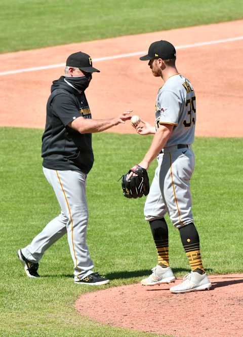 KANSAS CITY, MISSOURI – SEPTEMBER 13: Manager Derek Shelton of the Pittsburgh Pirates takes the ball away from starting pitcher Chad Kuhl as Kuhl leaves the game in the third inning against the Kansas City Royals at Kauffman Stadium on September 13, 2020 in Kansas City, Missouri. (Photo by Ed Zurga/Getty Images)