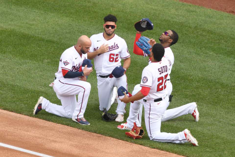 WASHINGTON, DC – SEPTEMBER 27: (L to R) Yadiel Hernandez #29, Luis Garcia #62 Victor Robles #16 and Juan Soto #22 of the Washington Nationals pray before a baseball game against the New York Mets at Nationals Park on September 27, 2020 in Washington, DC. (Photo by Mitchell Layton/Getty Images)