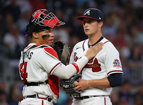 ATLANTA, GEORGIA – MAY 18: William Contreras #24 converses with Tucker Davidson #64 of the Atlanta Braves during the sixth inning against the New York Mets at Truist Park on May 18, 2021 in Atlanta, Georgia. (Photo by Kevin C. Cox/Getty Images)