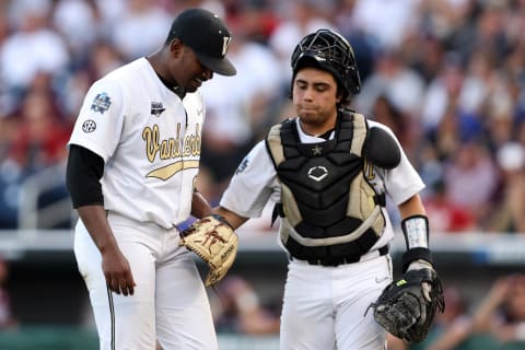 OMAHA, NEBRASKA – JUNE 30: Kumar Rocker #80 of the Vanderbilt and CJ Rodriguez #5 of the Vanderbilt react after closing out the top of the fourth inning during game three of the College World Series Championship at TD Ameritrade Park Omaha on June 30, 2021 in Omaha, Nebraska. (Photo by Sean M. Haffey/Getty Images)