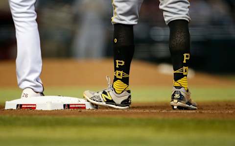 PHOENIX, ARIZONA – JULY 21: The socks of Adam Frazier #26 of the Pittsburgh Pirates as he stands on first base during the seventh inning of the MLB game against the Arizona Diamondbacks at Chase Field on July 21, 2021 in Phoenix, Arizona. (Photo by Ralph Freso/Getty Images)