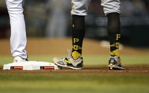 PHOENIX, ARIZONA – JULY 21: The socks of Adam Frazier #26 of the Pittsburgh Pirates as he stands on first base during the seventh inning of the MLB game against the Arizona Diamondbacks at Chase Field on July 21, 2021 in Phoenix, Arizona. (Photo by Ralph Freso/Getty Images)