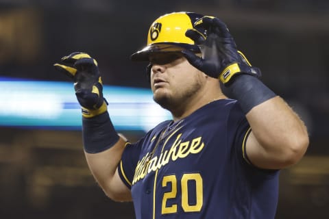 LOS ANGELES, CALIFORNIA – OCTOBER 01: Daniel Vogelbach #20 of the Milwaukee Brewers reacts while on first base against the Los Angeles Dodgers during the eighth inning at Dodger Stadium on October 01, 2021 in Los Angeles, California. (Photo by Michael Owens/Getty Images)