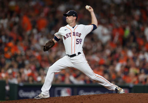 HOUSTON, TEXAS – OCTOBER 15: Brooks Raley #58 of the Houston Astros pitches against the Boston Red Sox in the eighth inning during Game One of the American League Championship Series at Minute Maid Park on October 15, 2021 in Houston, Texas. (Photo by Elsa/Getty Image