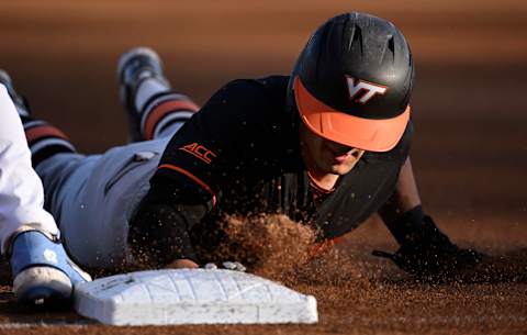 CHAPEL HILL, NORTH CAROLINA – APRIL 01: Cade Hunter #17 of the Virginia Tech Hokies slides back to first base during the first inning against the North Carolina Tar Heels at Boshamer Stadium on April 01, 2022 in Chapel Hill, North Carolina. (Photo by Eakin Howard/Getty Images)