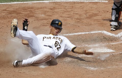 PITTSBURGH, PA – JULY 8: Gorkys Hernandez #62 of the Pittsburgh Pirates scores in the sixth inning on a throw error by the San Francisco Giants during the game on July 8, 2012 at PNC Park in Pittsburgh, Pennsylvania. The Pirates defeated the Giants 13-2. (Photo by Justin K. Aller/Getty Images)