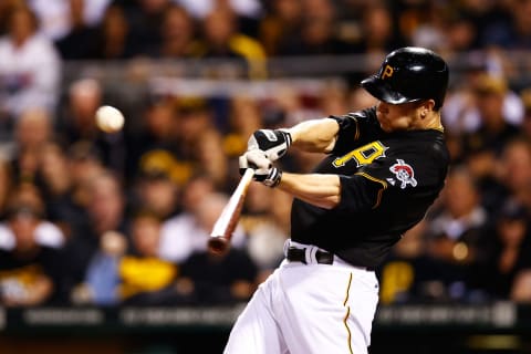 PITTSBURGH, PA – OCTOBER 01: Justin Morneau #66 of the Pittsburgh Pirates hits a single in the sixth inning against the Cincinnati Reds during the National League Wild Card game at PNC Park on October 1, 2013 in Pittsburgh, Pennsylvania. (Photo by Jared Wickerham/Getty Images)