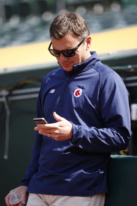 OAKLAND, CA – MAY 11: General Manager Ben Cherington of the Boston Red Sox checks messages on his phone prior to the game against the Oakland Athletics at O.co Coliseum on May 11, 2015 in Oakland, California. The Red Sox defeated the Athletics 5-4. (Photo by Michael Zagaris/Oakland Athletics/Getty Images)