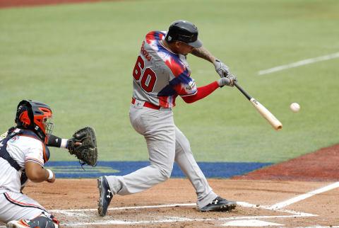 Christian Bethancourt of Aguilas Cibaenas of the Dominican Republic bats against Caribes de Anzoategui of Venezuela during the Caribbean Baseball Series at the Charros Jalisco stadium in Guadalajara, Jalisco state, Mexico, on February 3, 2018. / AFP PHOTO / ULISES RUIZ (Photo credit should read ULISES RUIZ/AFP via Getty Images)