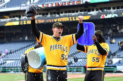 PITTSBURGH, PA – APRIL 08: Jameson Taillon #50 is doused with Powerade and bubble gum by Starling Marte #6 and Josh Bell #55 of the Pittsburgh Pirates after throwing a complete game shutout against the Cincinnati Reds at PNC Park on April 8, 2018 in Pittsburgh, Pennsylvania. (Photo by Joe Sargent/Getty Images)